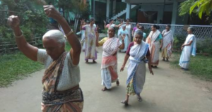A group of elderly women in India dancing and enjoying themselves