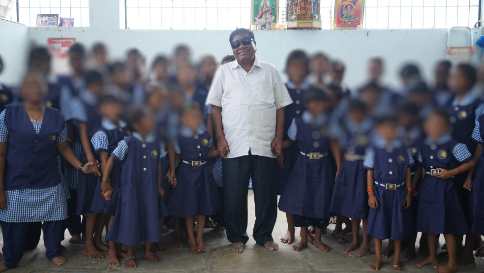 the founder Professor Dattu Agarwal with students in the school