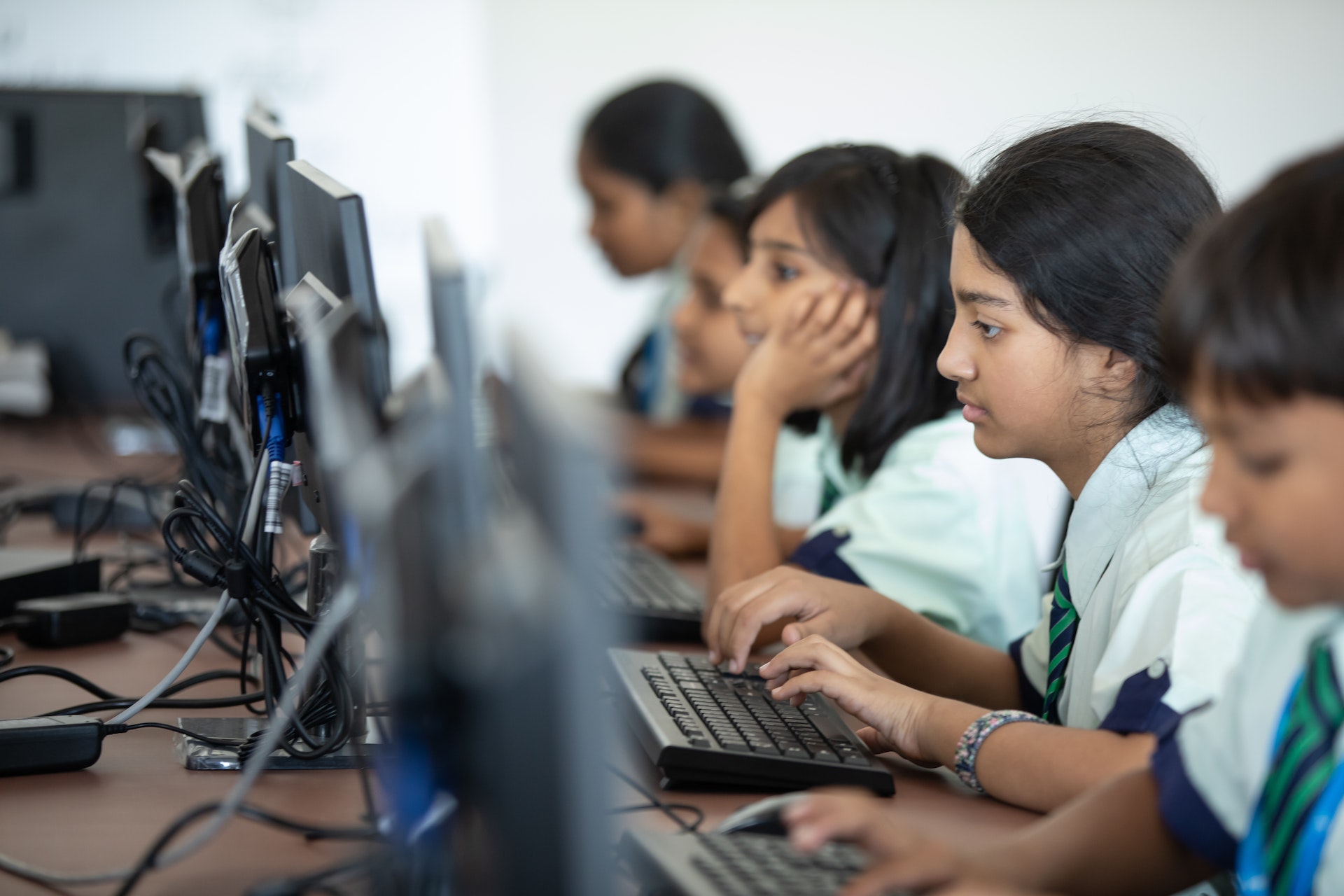 Indian students in a classroom working on computers