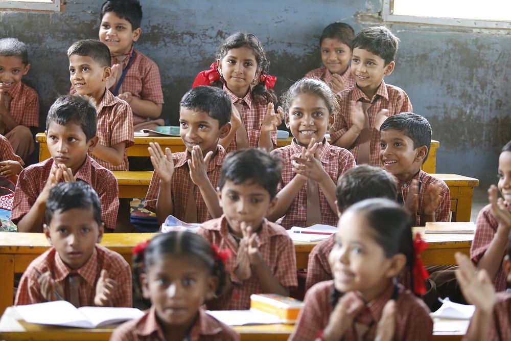 a classroom in India with boys and girls