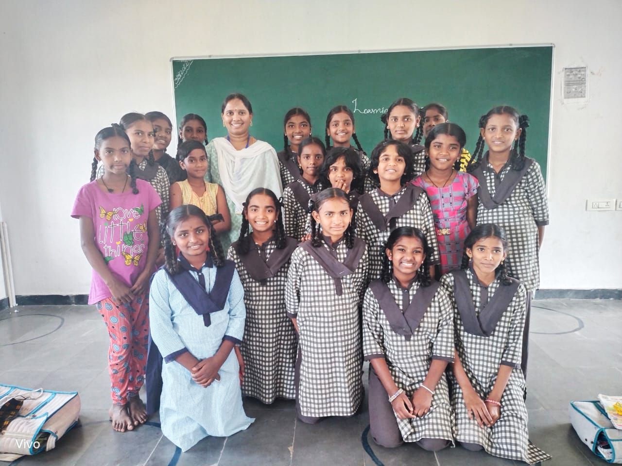 a teacher and her students at Learning Curve Skills Foundation
