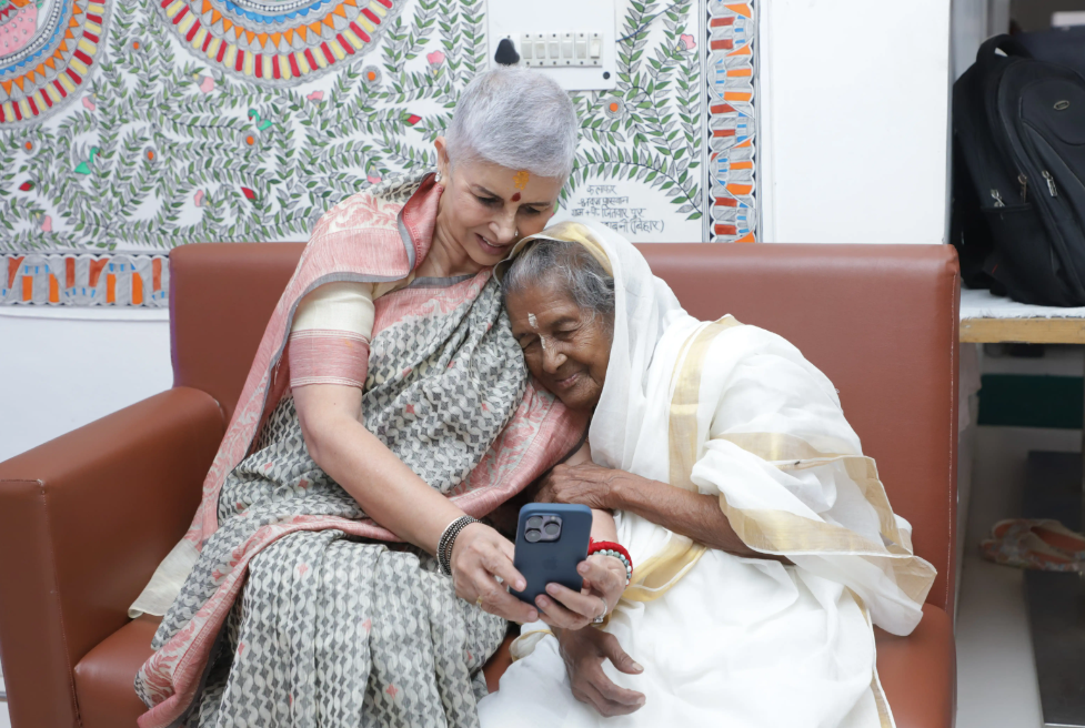 the founder of Maitri with an elderly woman