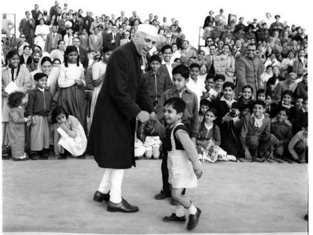 Jawaharlal Nehru and children playing together