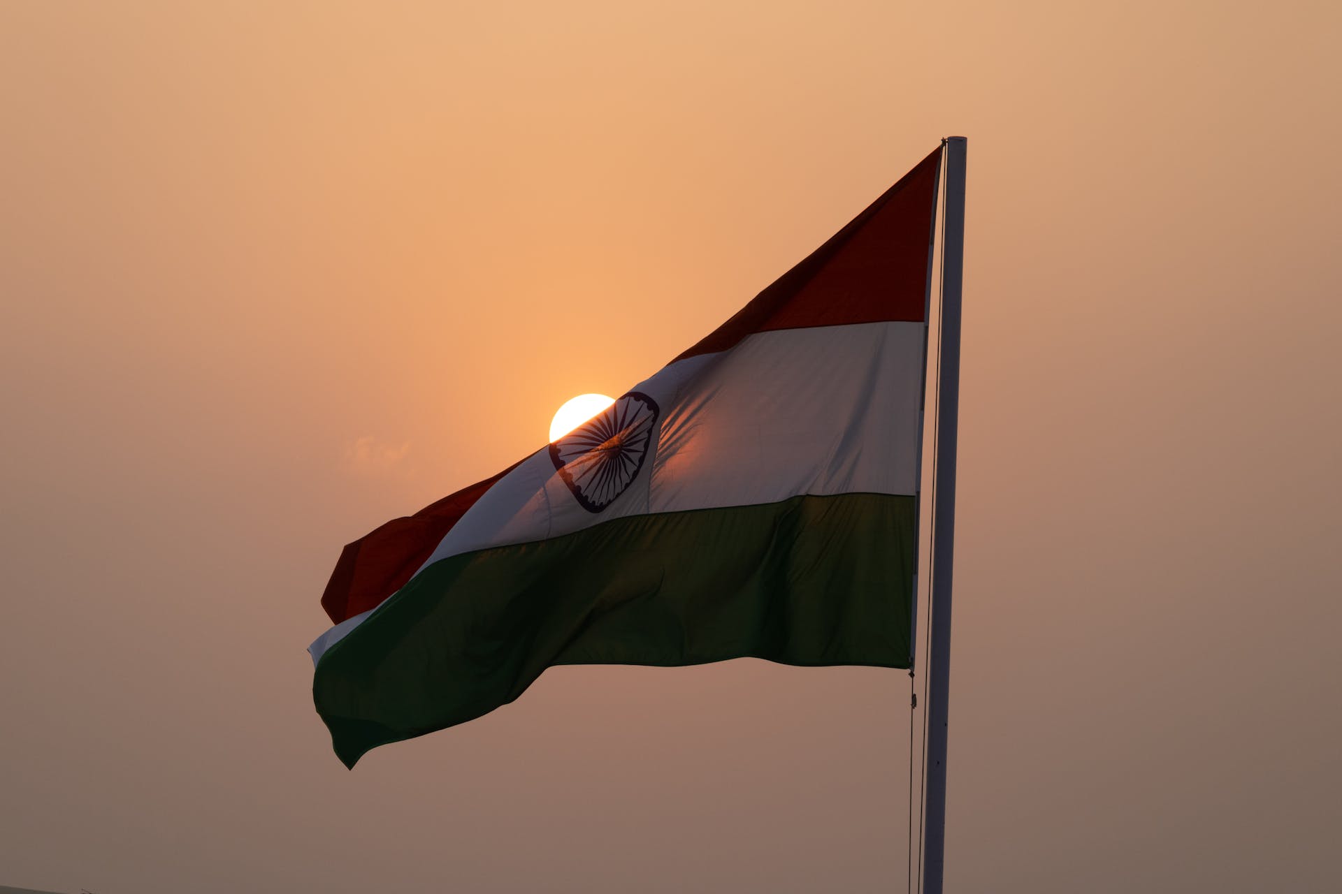 Indian flag against the sunset
