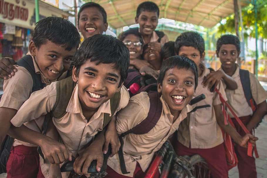 school children in India smiling at the camera