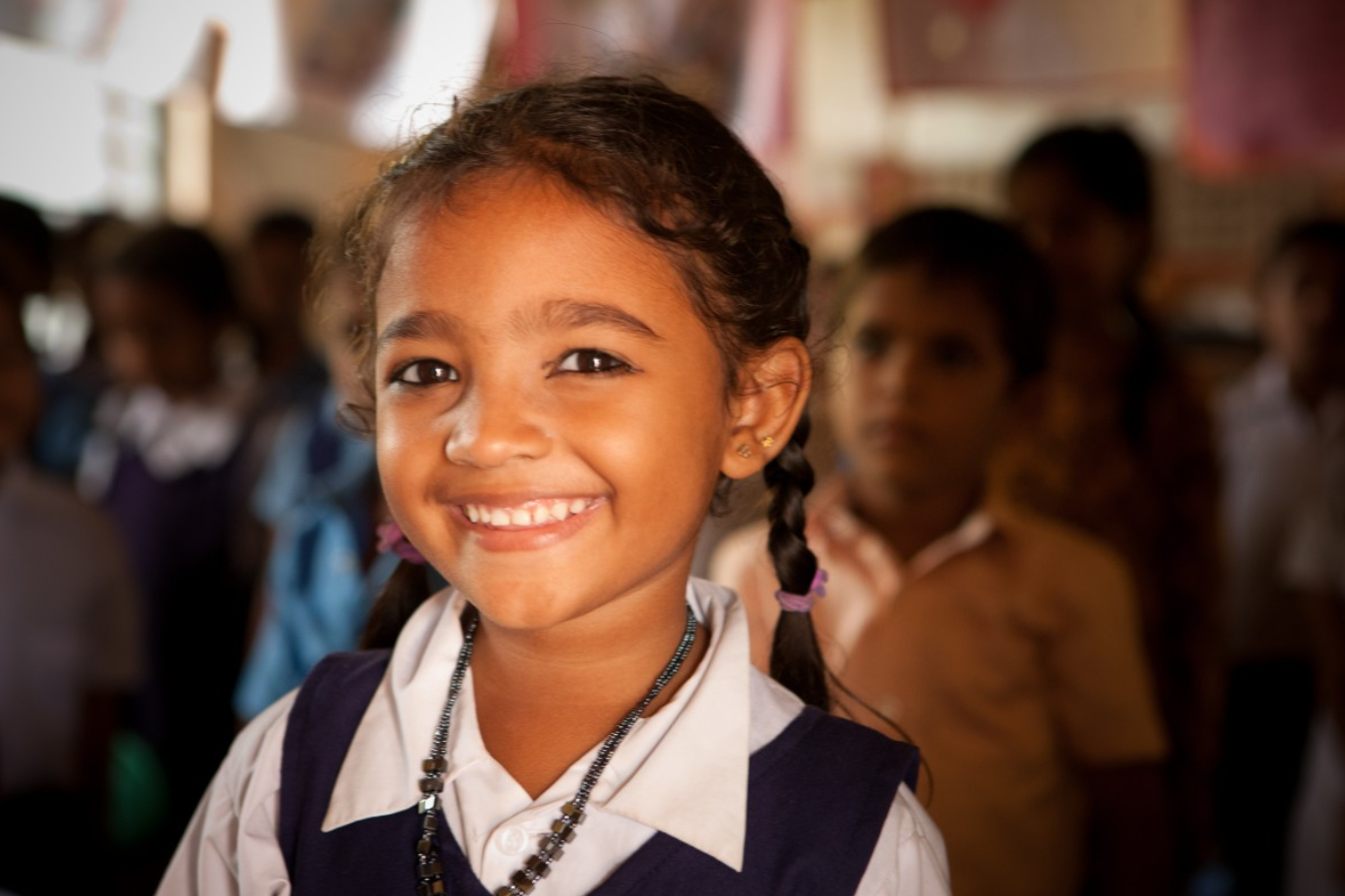 a smiling Indian school girl