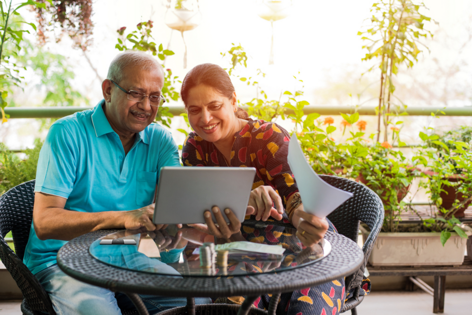 two people looking happily at a laptop