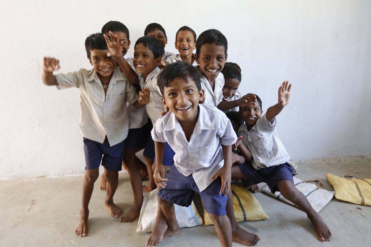 a group of happy Indian children laughing at the camera