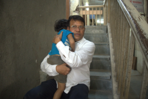 a man carrying a child