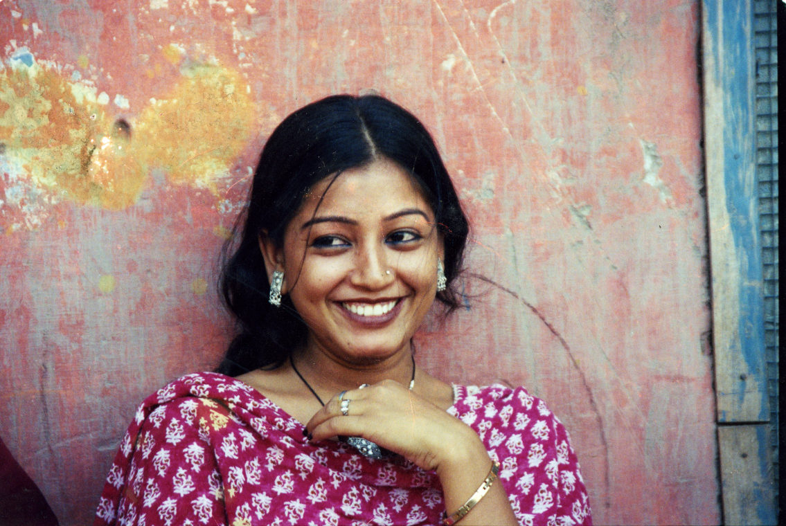 a young Indian woman smiling