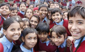 a group of school children smiling