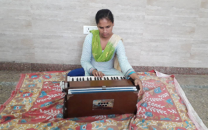 a visually impaired girl playing a musical instrument