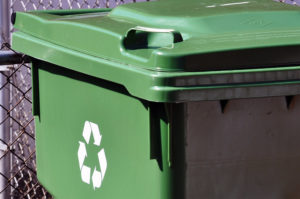 a green recycling bin