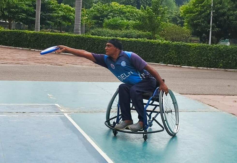 a man in a wheelchair playing sports