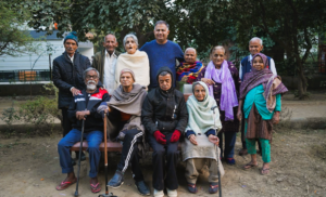 a group of elderly people posing for a group picture 