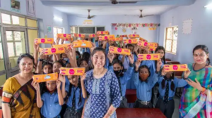 a group of girls and women holding sanitary pads 