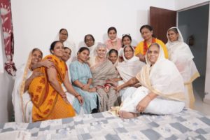 a group of elderly women smiling at the camera