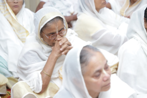 an elderly widow in India praying