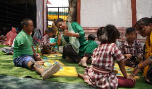 a woman playing with children