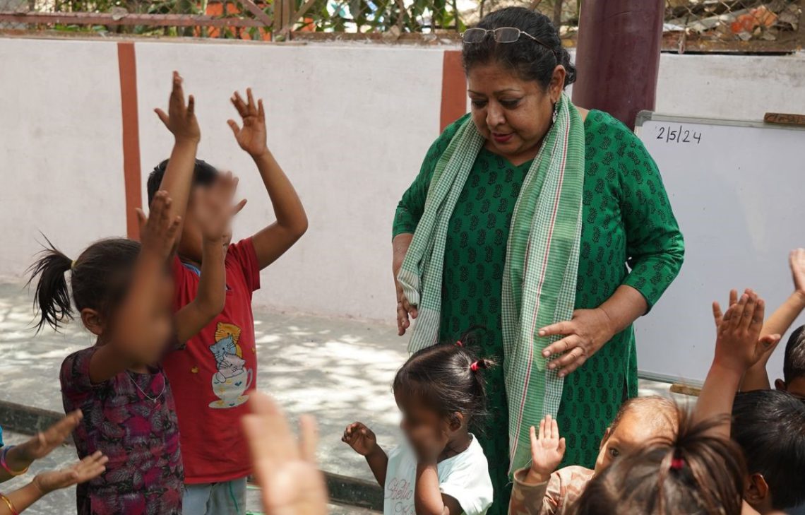 a woman playing with children