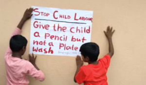 two children holding up a sign