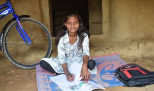 a girl studying on the floor