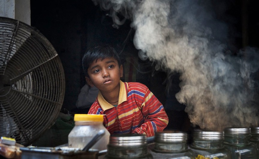a young boy working at a restaurant