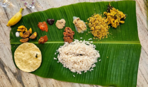 a traditional Indian meal on a banana leaf