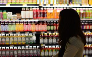 a person looking at store shelves