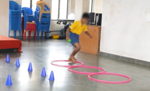 a child playing with objects on the floor